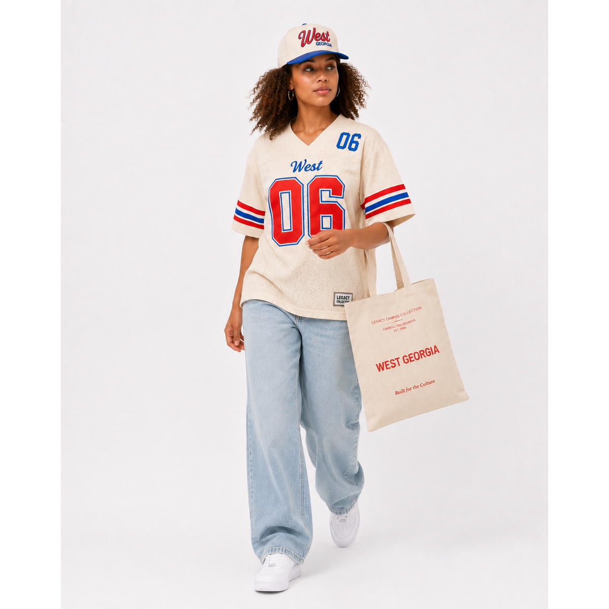 West Georgia Legacy Campus Collection female campaign model wearing cream West Georgia jersey and cap with tote