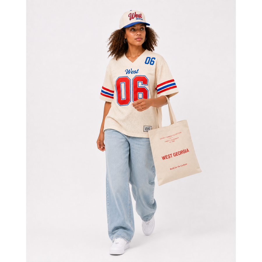 West Georgia Legacy Campus Collection female campaign model wearing cream West Georgia jersey and cap with tote alternate view